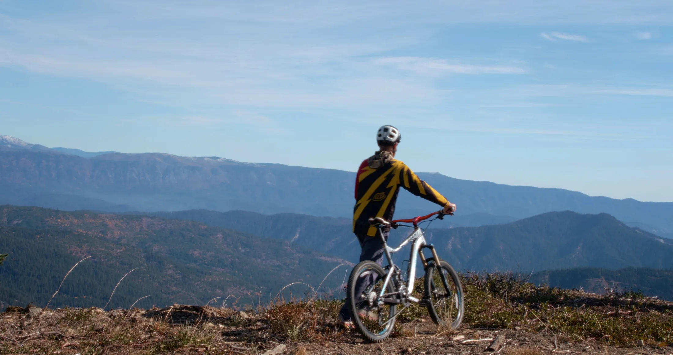 Mountain biker riding a ridge trail