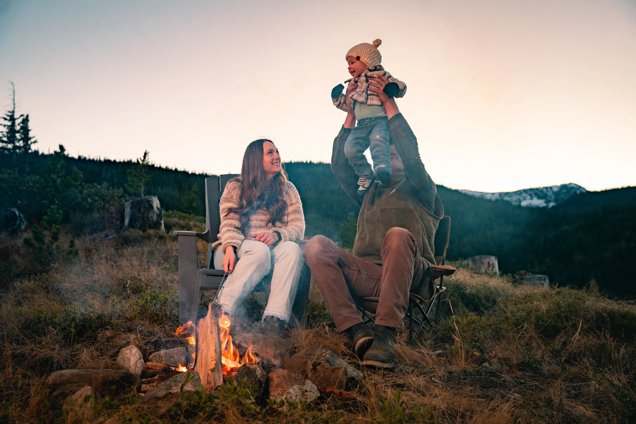 Friends gathered around an evening fire