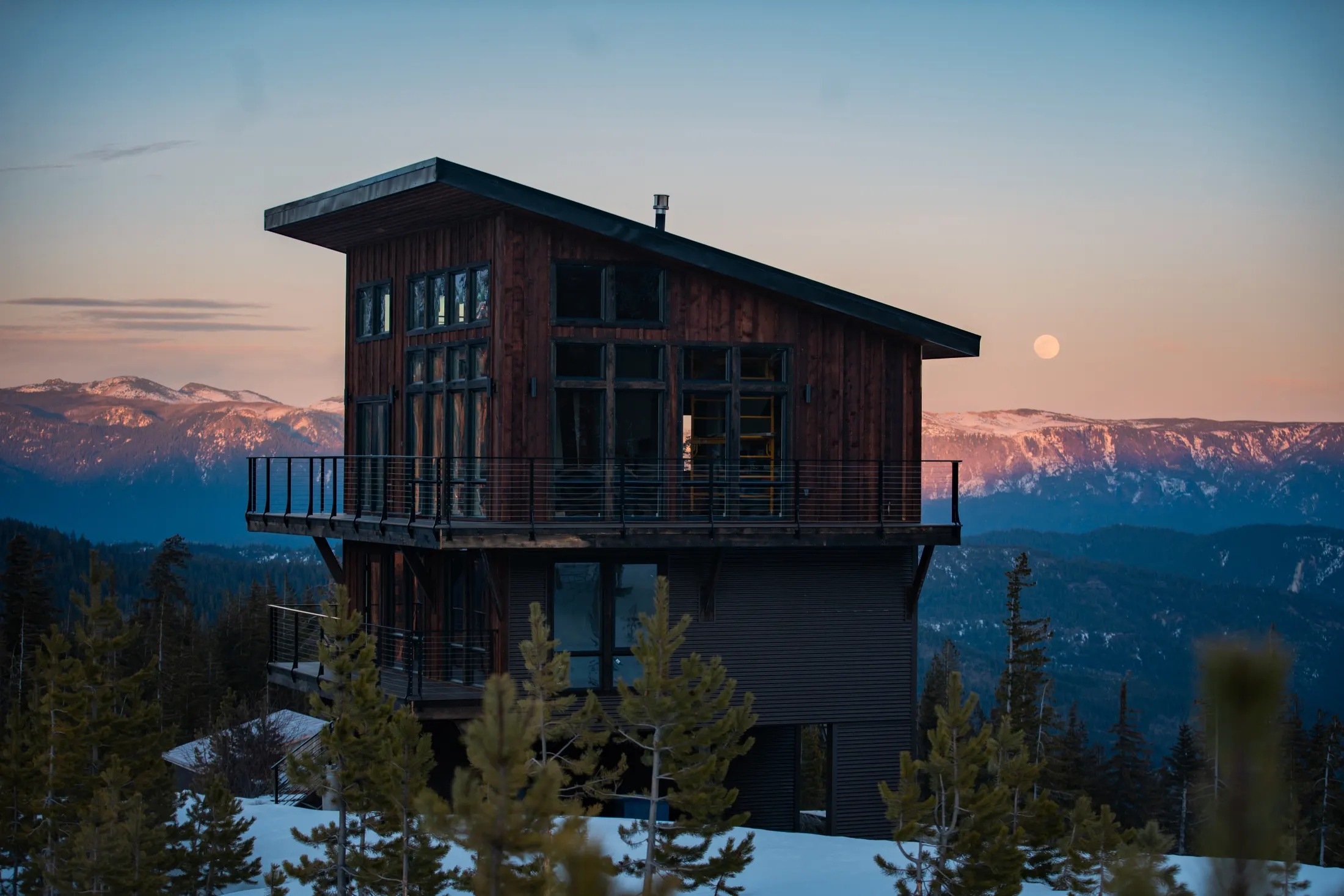 Watchtower cabin lit up at twilight