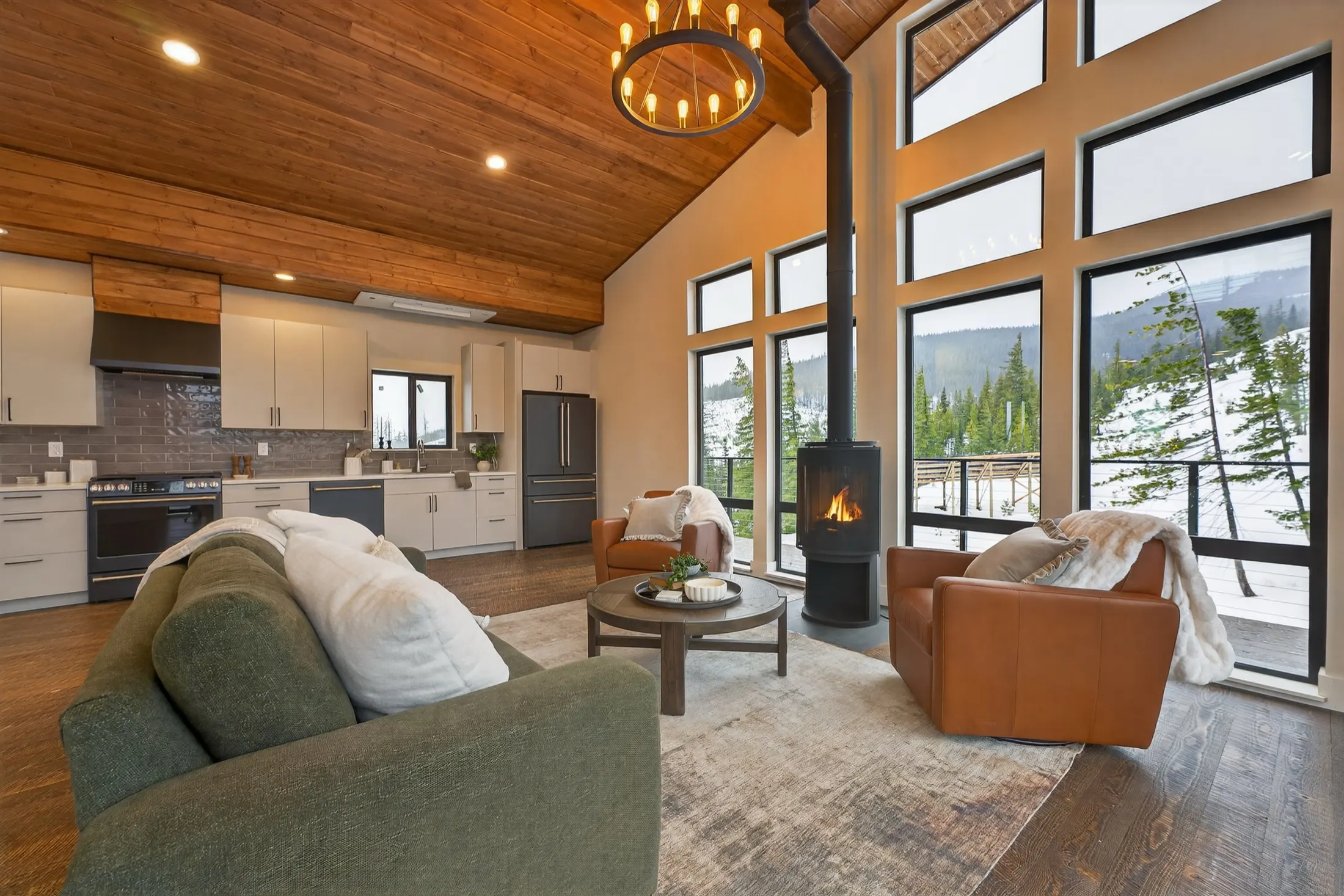 Living room and kitchen under a wood ceiling