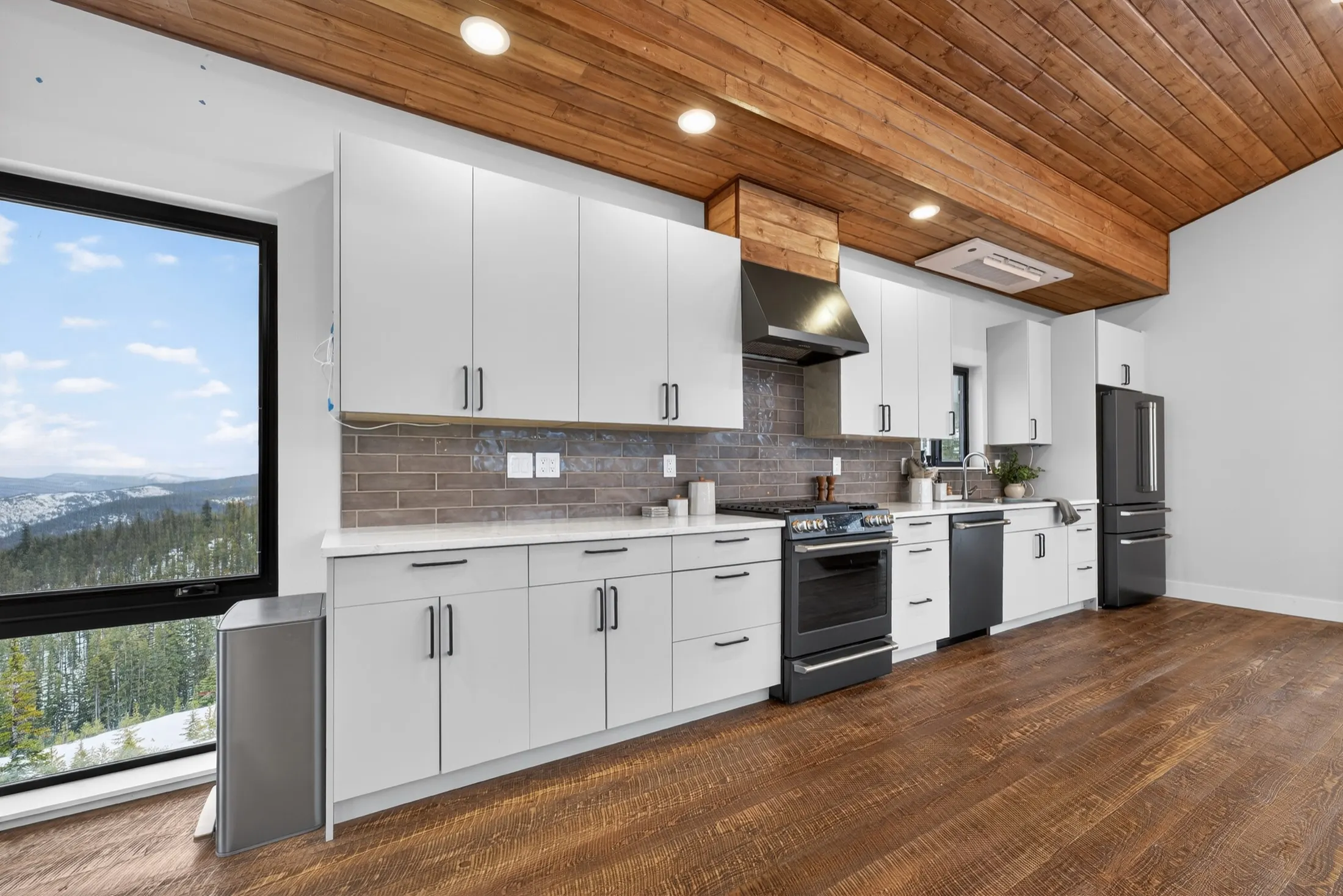 Kitchen along a wall of windows