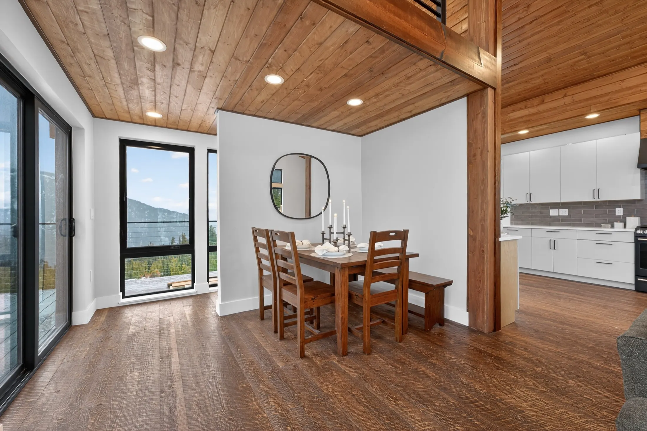 Dining table beside sliding doors to the deck