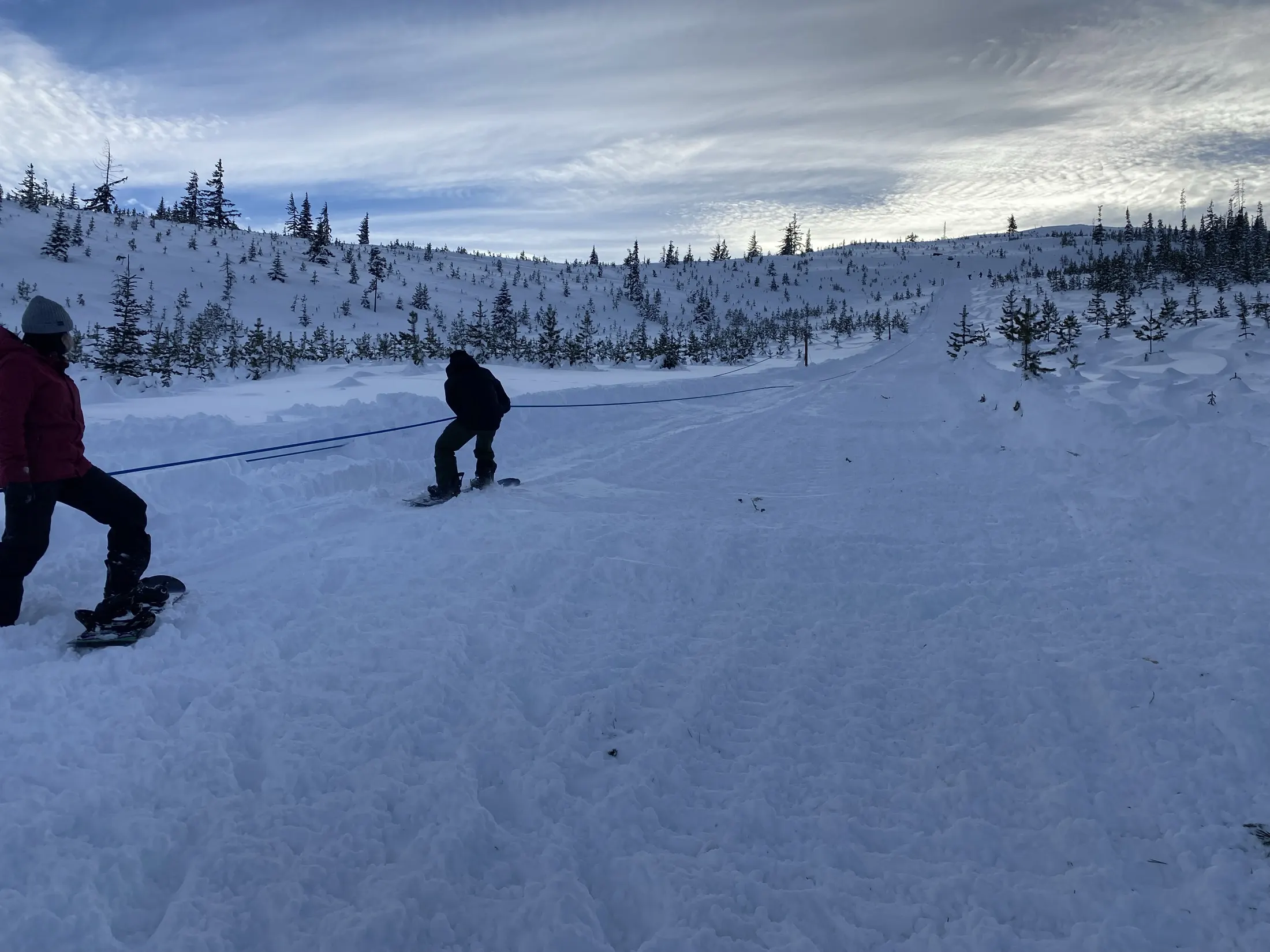 Snowshoers crossing a groomed snowfield