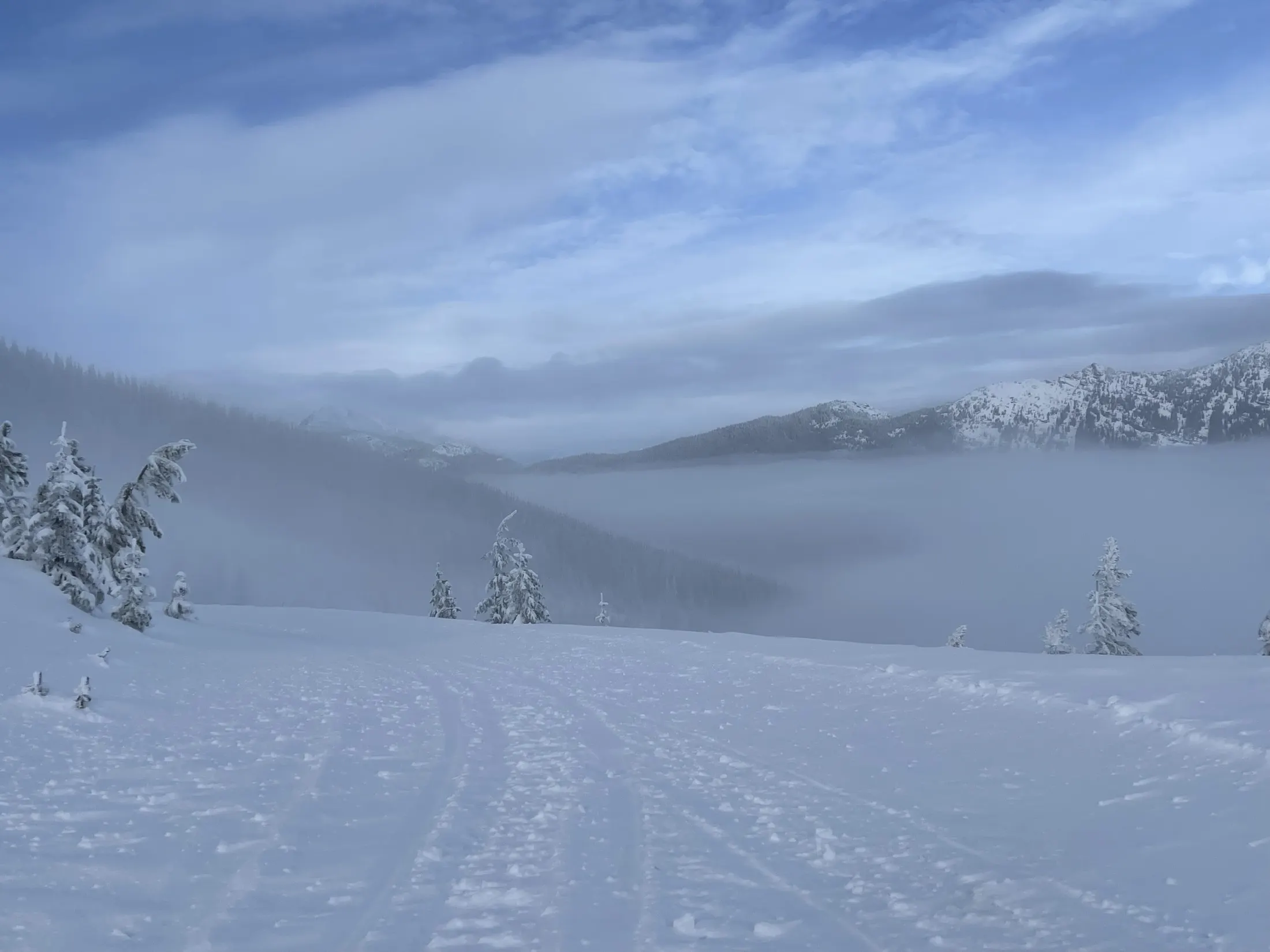 Fog rolling across a snowy plateau